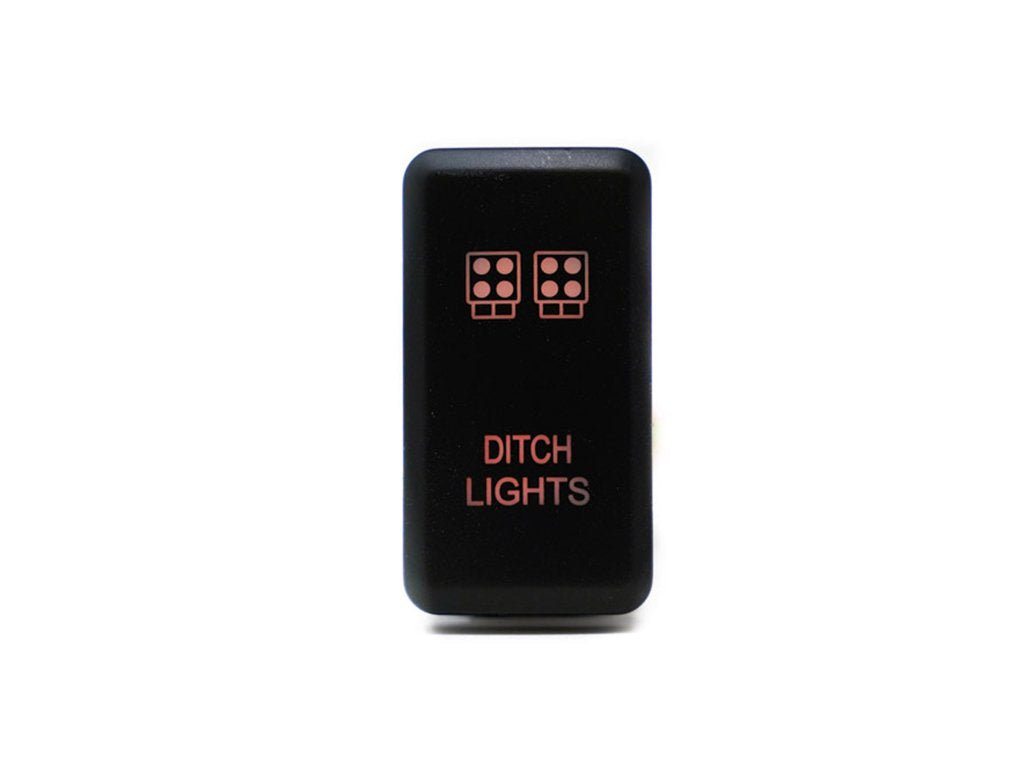 Black rectangular ditch light switch with amber LED symbols for off-road vehicles