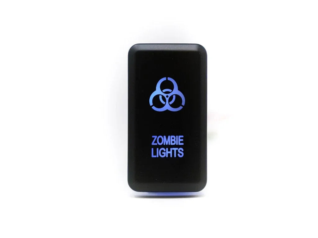 Black rocker switch with blue biohazard symbol and text reading Zombie Lights, isolated on white