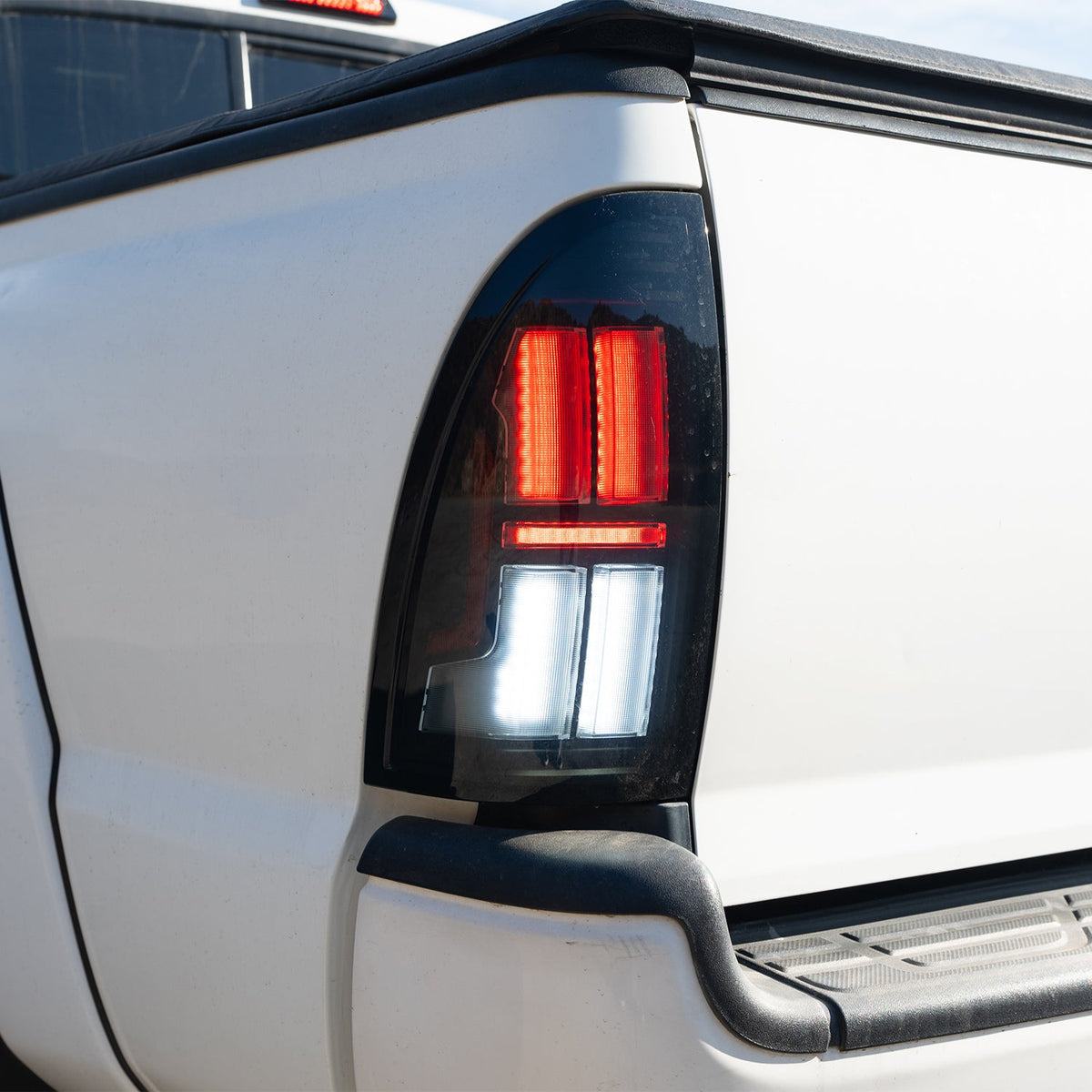 AlphaRex NOVA-Series Prismatic LED Tail Lights for Toyota Tacoma - Black Clear