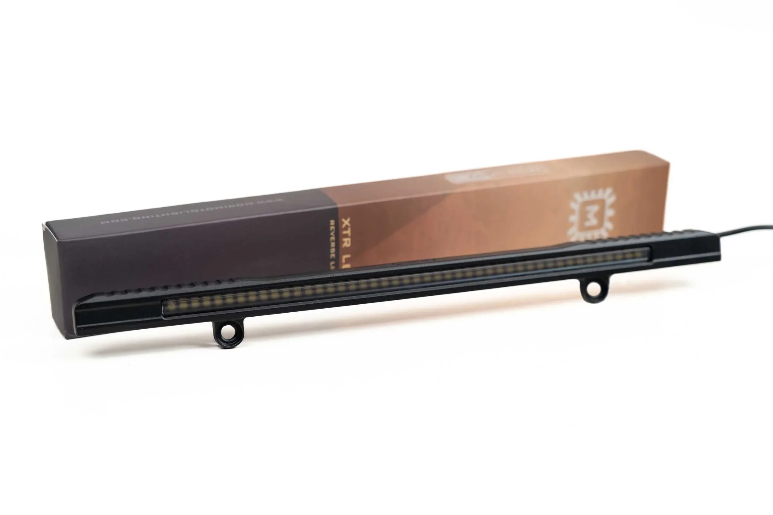 Slim black LED reverse light bar for overlanding vehicles with product box