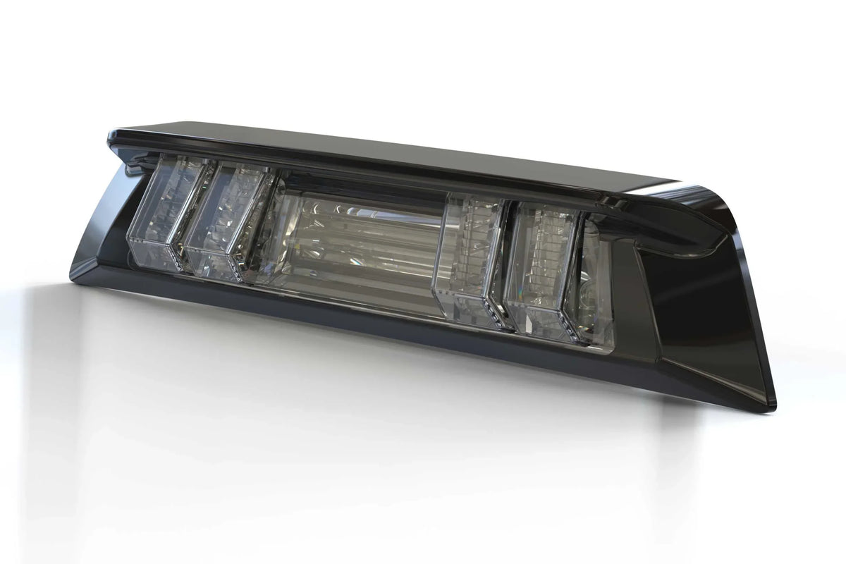 Clear lens LED third brake light assembly for Toyota Tacoma trucks, angled view