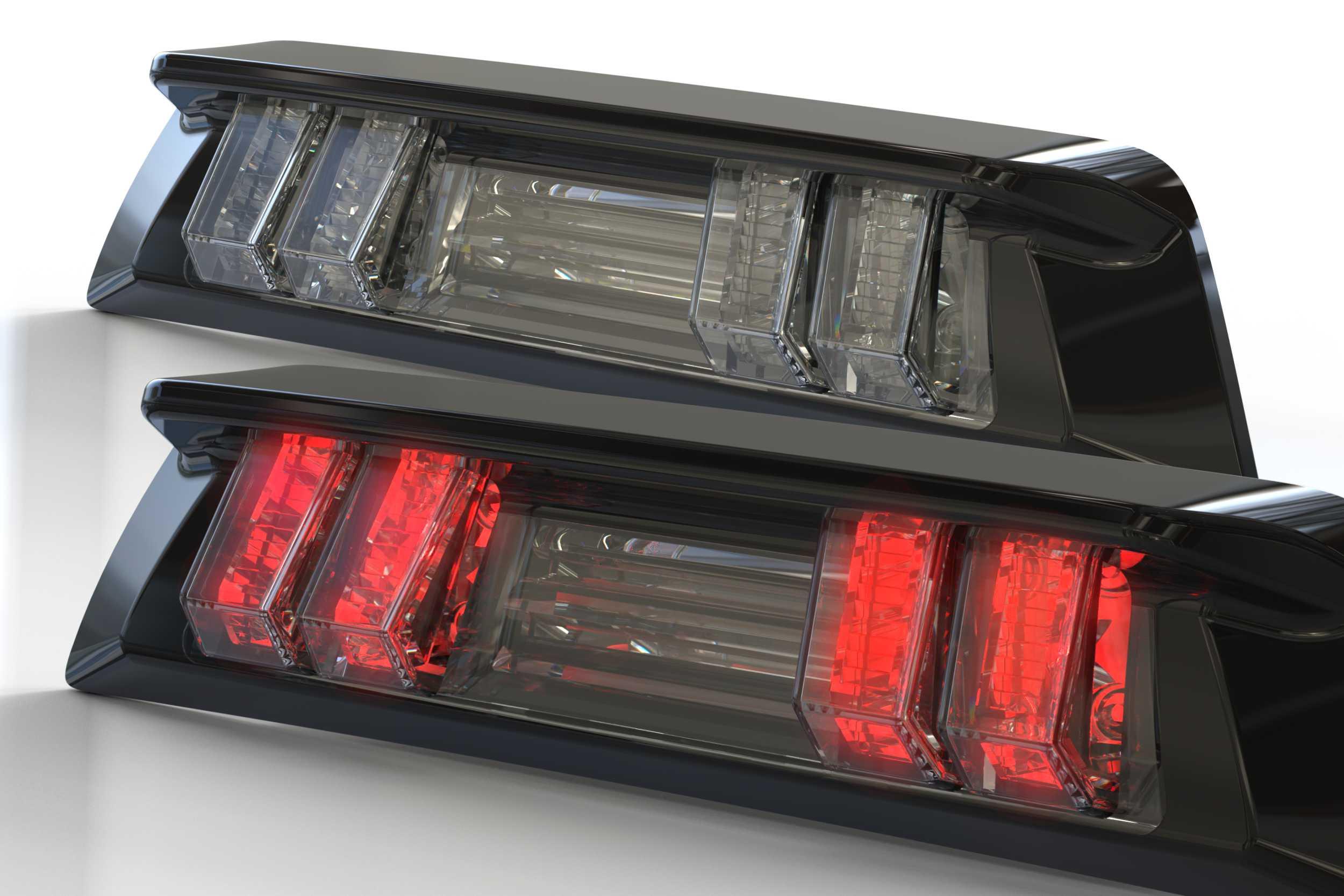 Modern LED taillights with black housing, one unlit and one illuminated, for off-road vehicles
