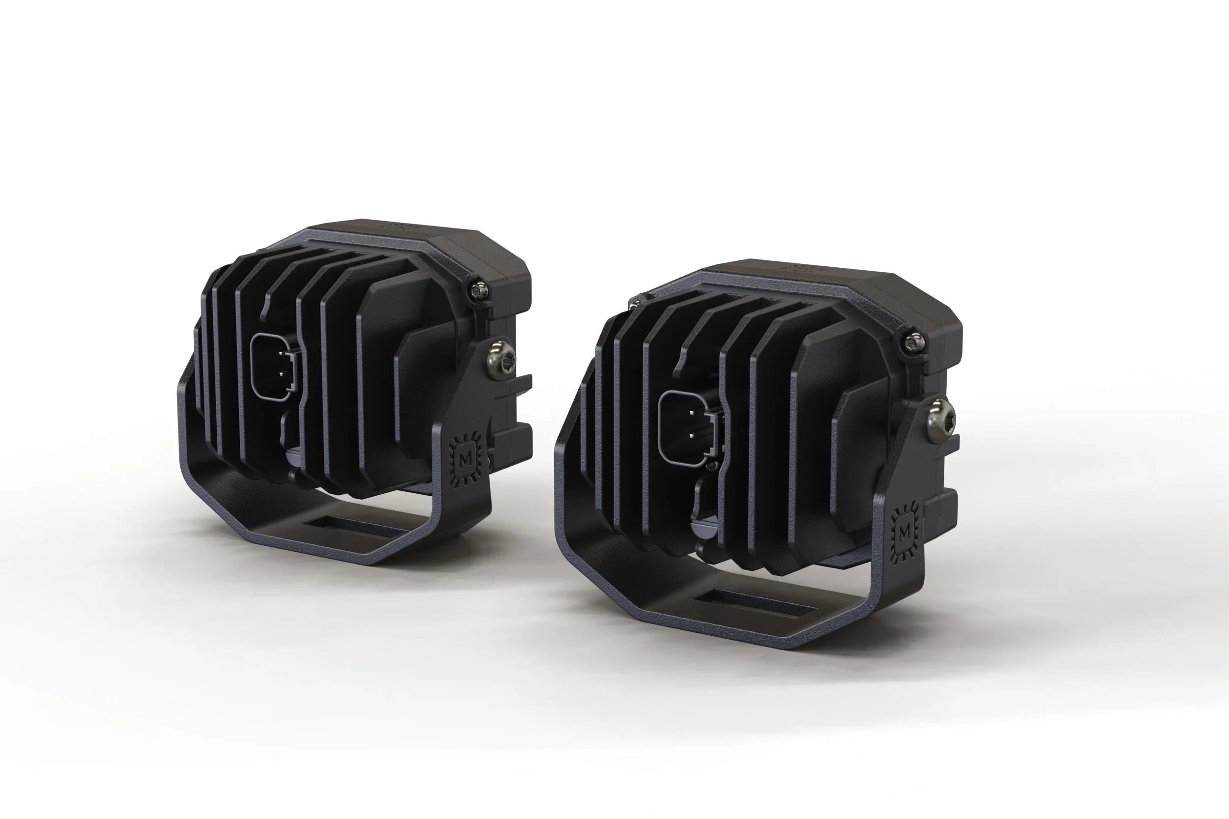 Pair of black off-road LED pod lights with cooling fins for overlanding vehicles