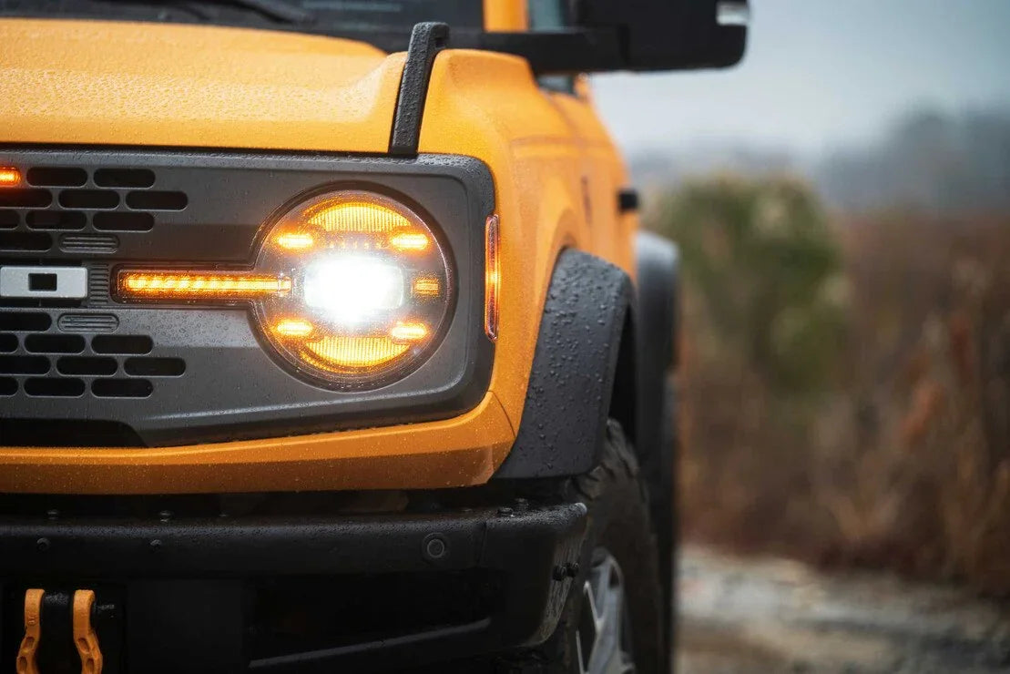 Close-up of yellow Ford Bronco front headlight with LED lights, off-road, adventure vehicle