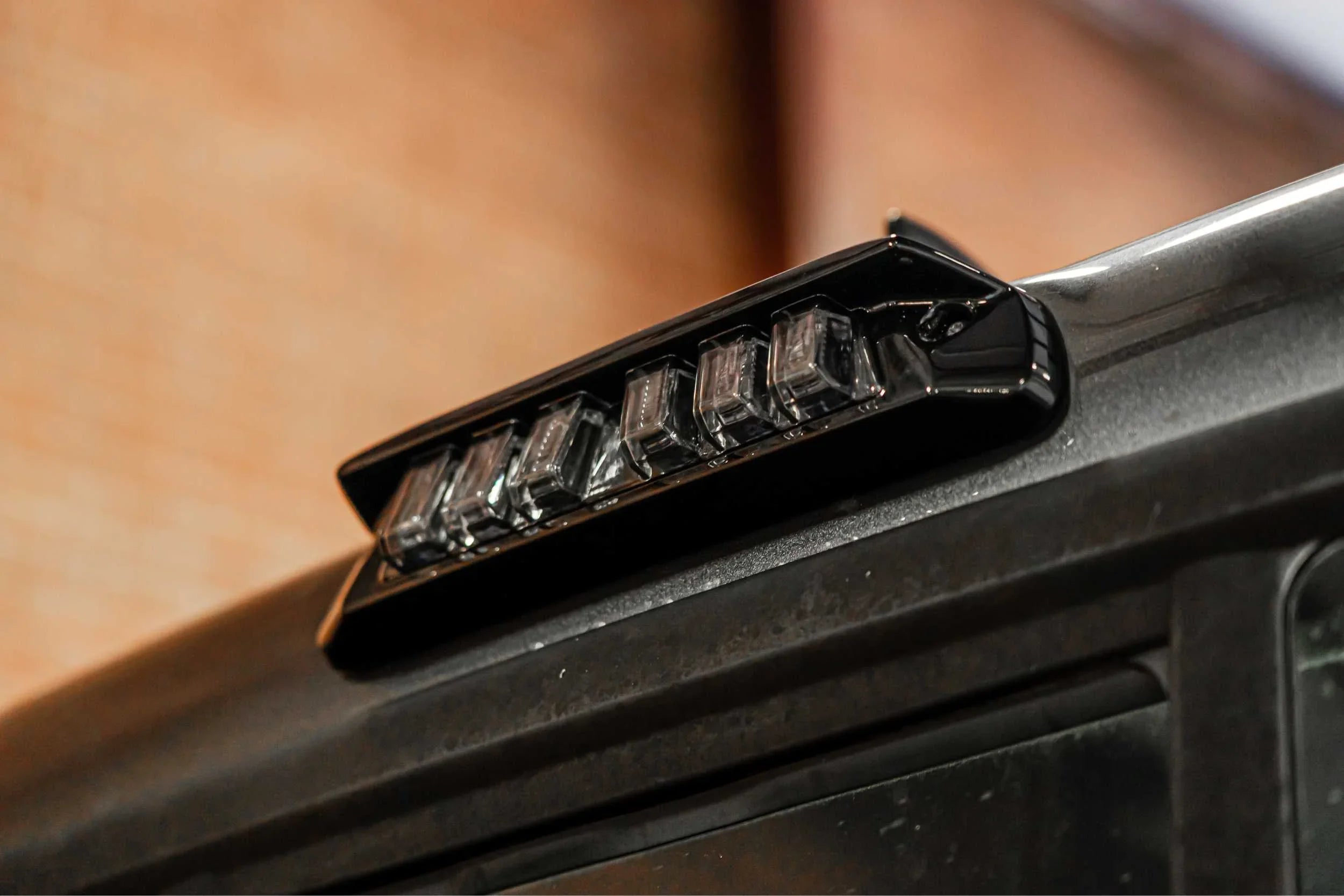 Close-up of black roof LED light bar mounted on off-road vehicle for overlanding