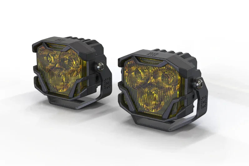 Pair of yellow off-road LED pod lights with rugged black housing, ideal for trucks and SUVs