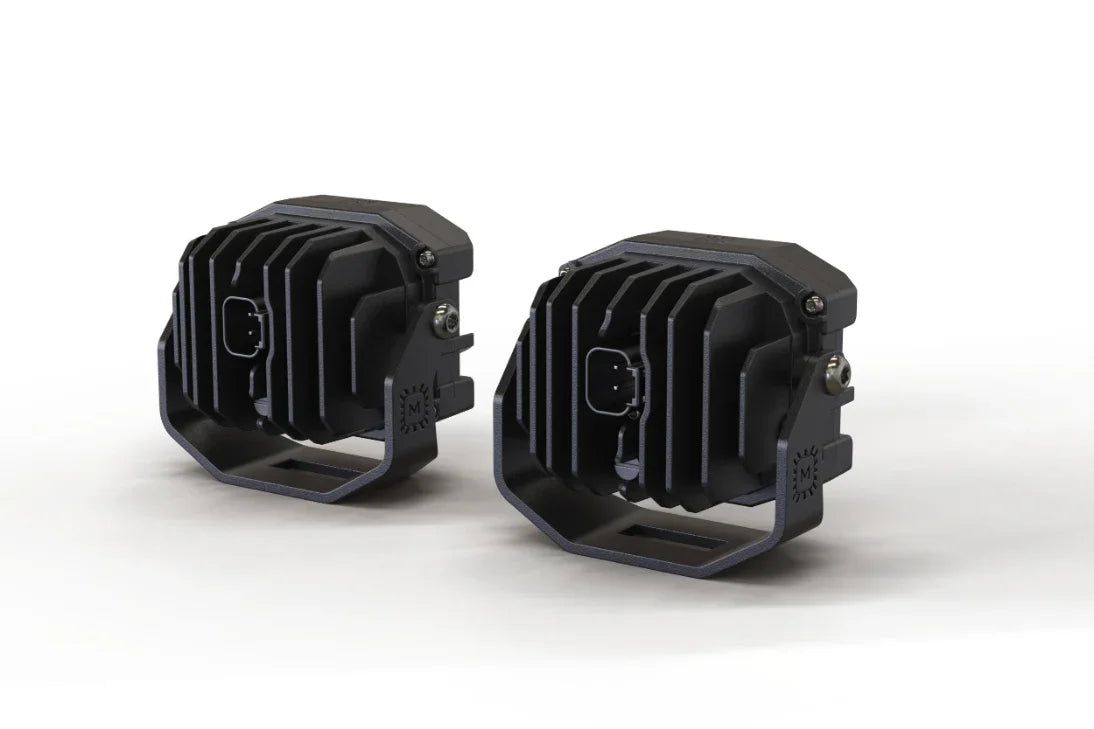 Pair of black off-road LED pod lights with cooling fins and mounting brackets, rear view
