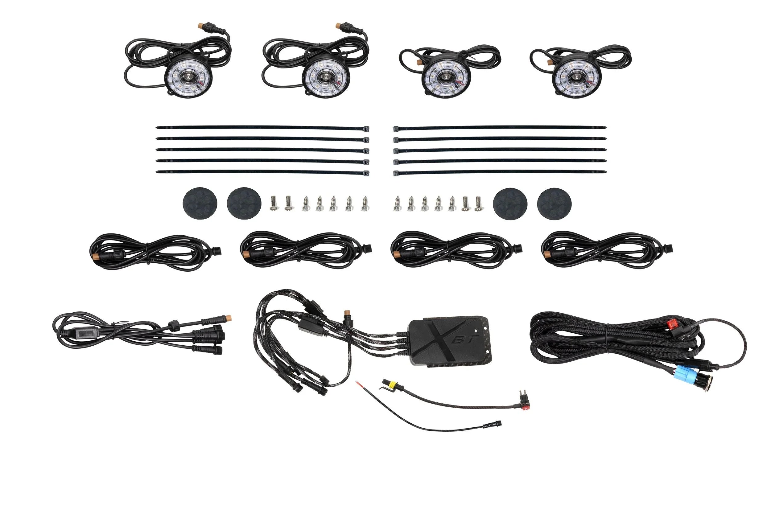 LED rock light kit with four lights, cables, control box, zip ties, and mounting hardware