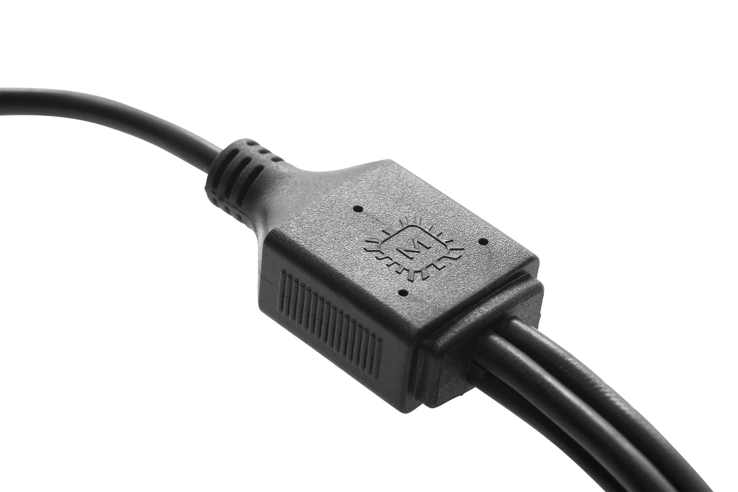 Close-up of a black electrical wiring connector with a molded plastic housing and wires