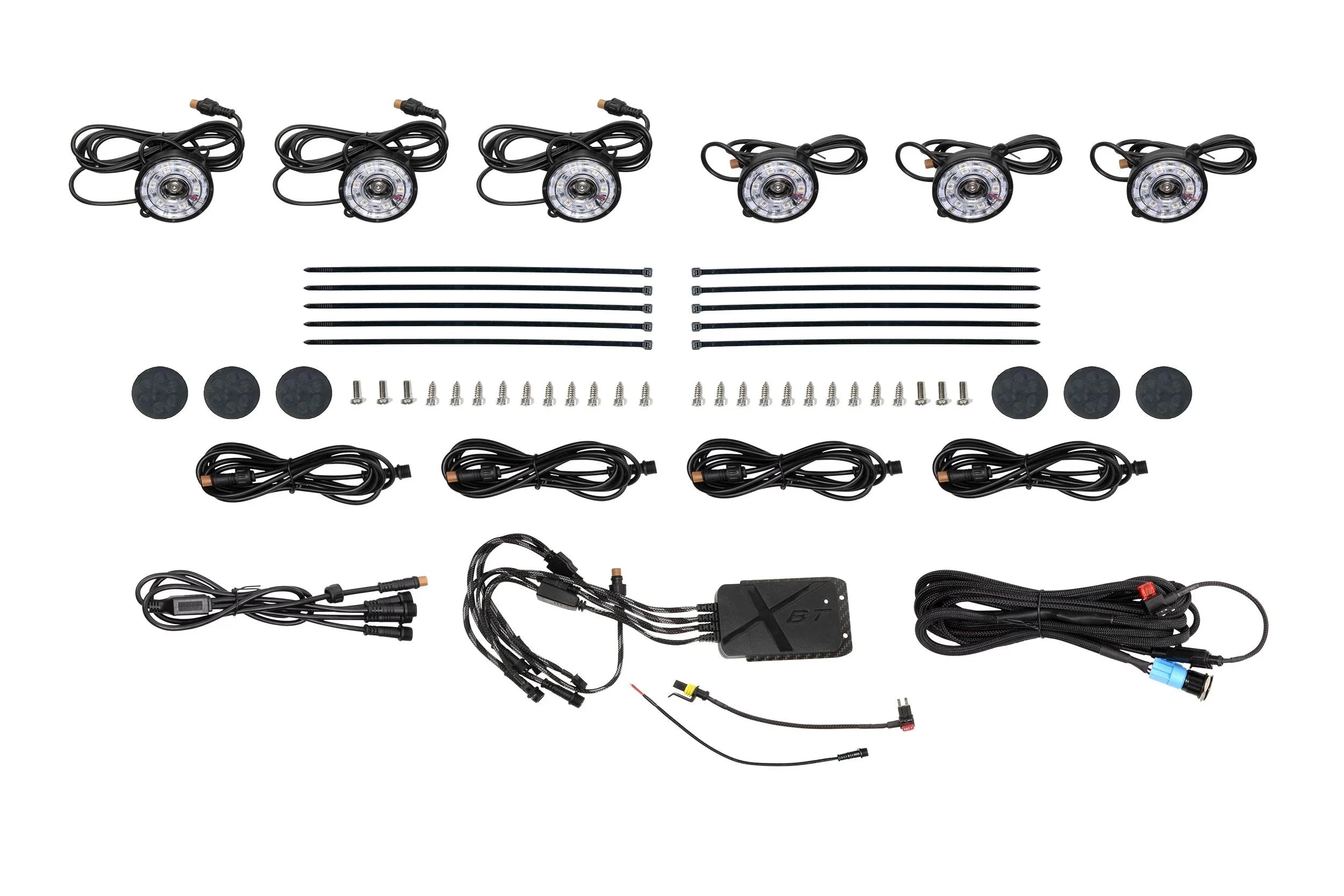LED rock lights kit with wiring, zip ties, control box, screws, and mounting pads for off-road vehicles