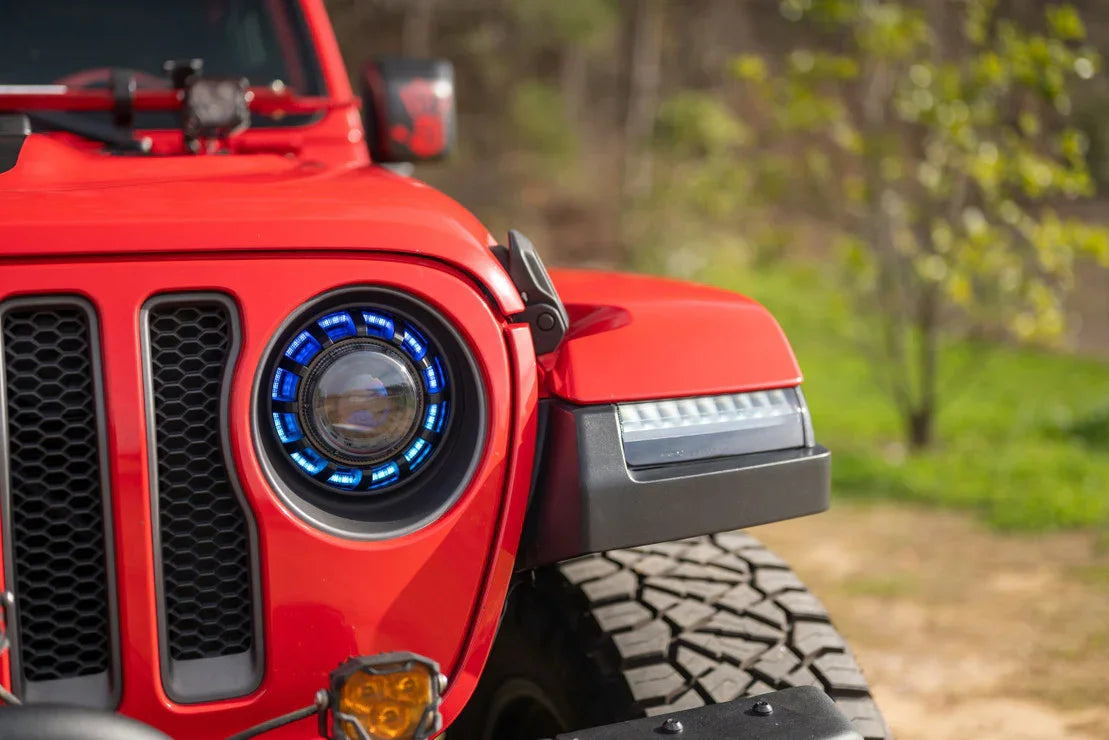 Red Jeep Wrangler with RGBW halo LED headlights and off-road accessories