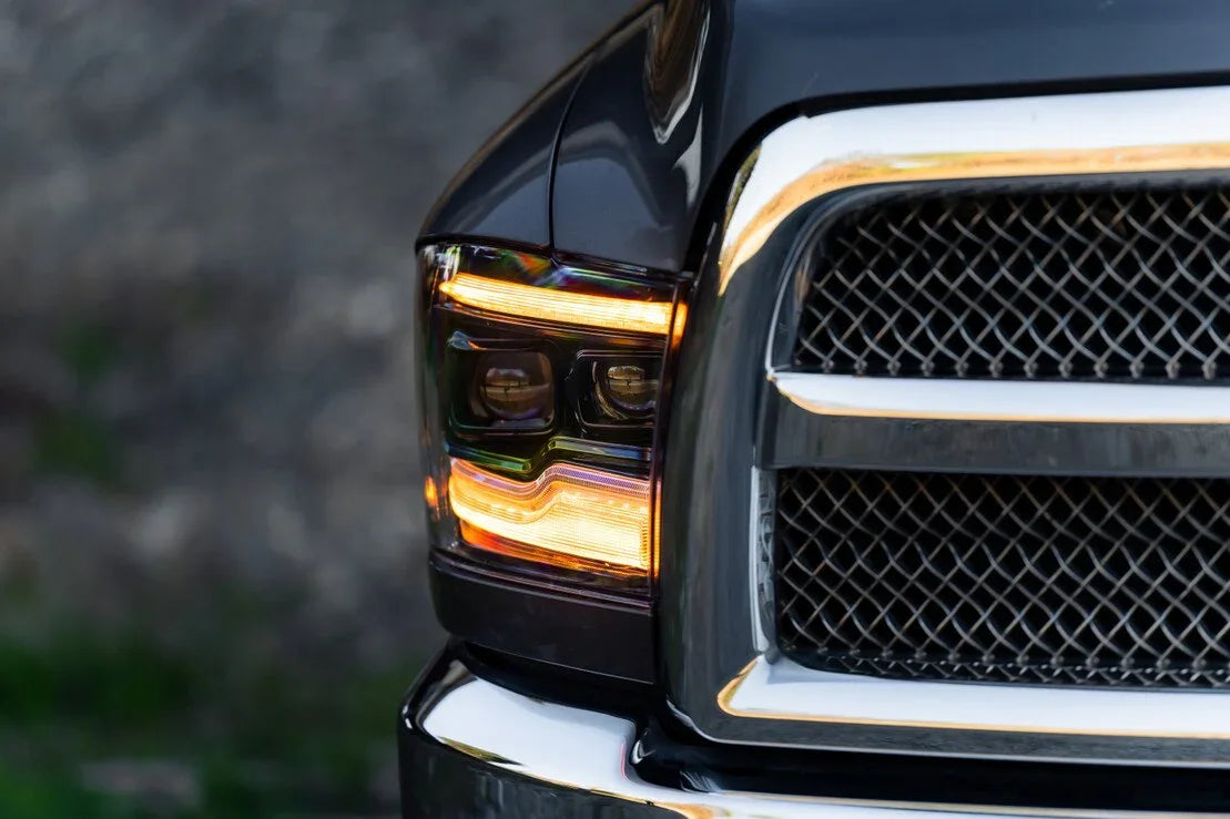 Closeup of 2019-2024 Ram Classic amber XB LED headlight on a black truck