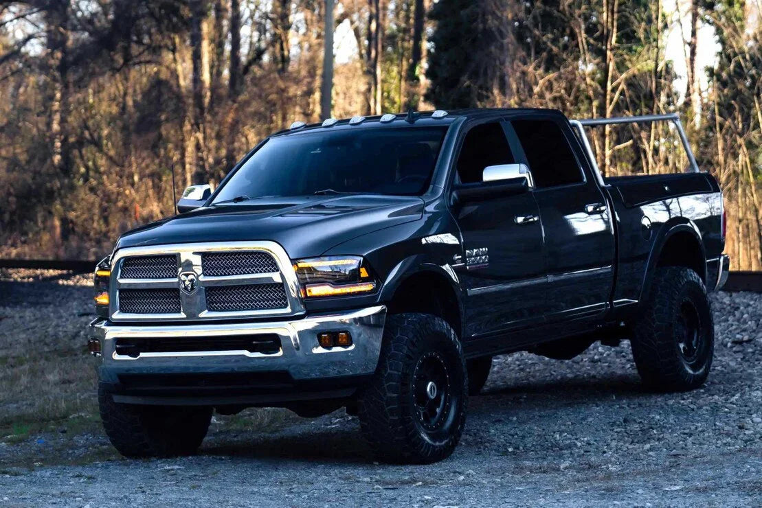 2019-2024 Ram pickup truck with amber XB LED headlights parked outdoors