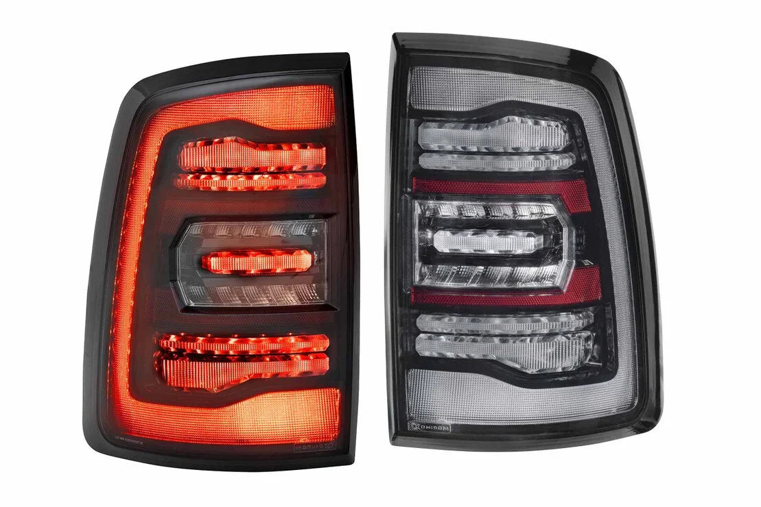 Pair of Dodge Ram LED tail lights, one illuminated, modern smoked lens design