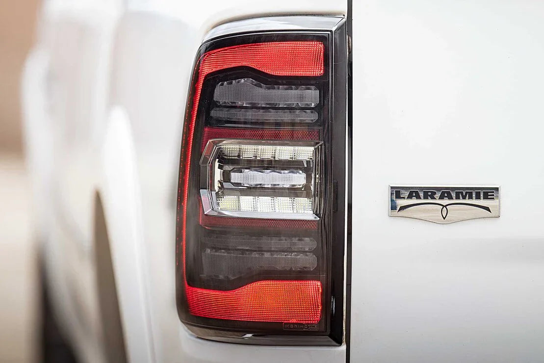LED tail light and Laramie badge on white Dodge Ram Classic pickup truck