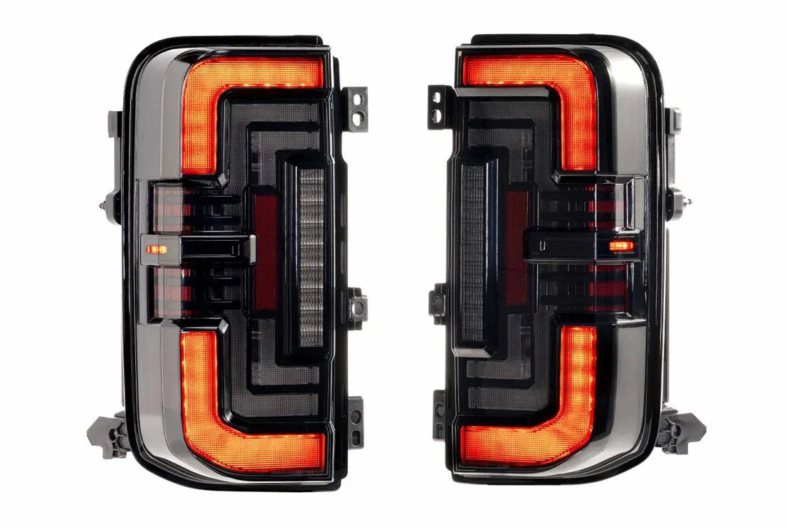 Pair of LED tail lights with black housing and red accents for Toyota Tacoma trucks