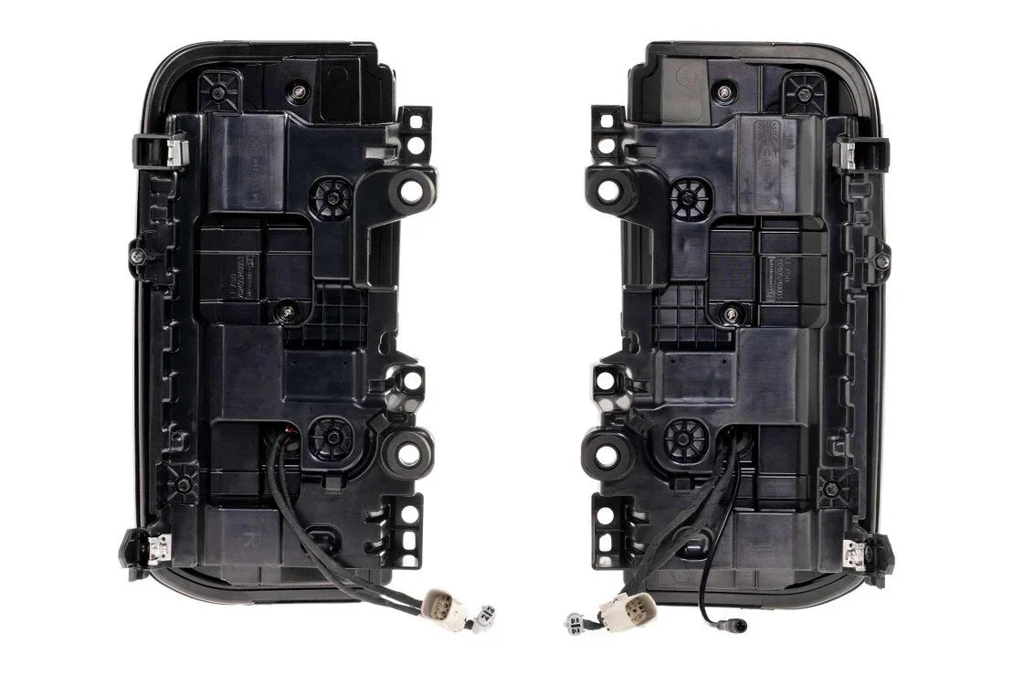 Pair of black LED tail light assemblies with wiring for Toyota or Jeep overlanding vehicles
