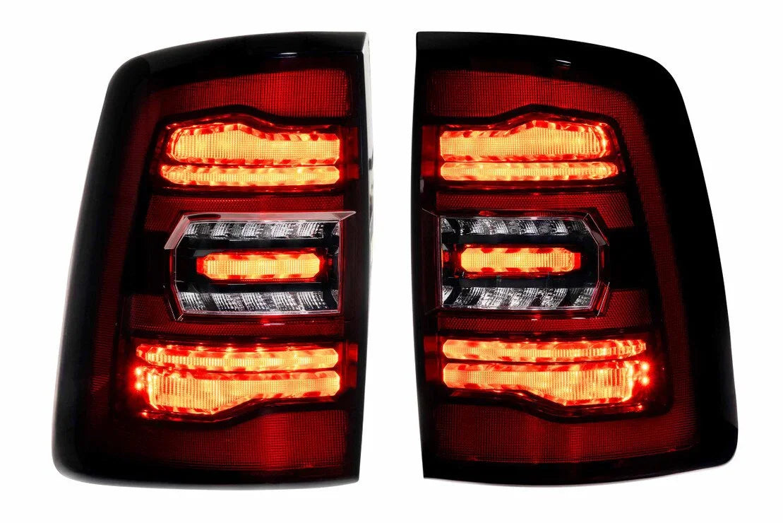 Pair of LED tail lights glowing red and amber, suitable for overlanding vehicles