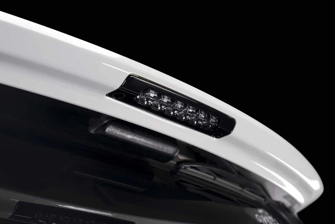 Close-up of rear LED brake light installed on a white off-road vehicle