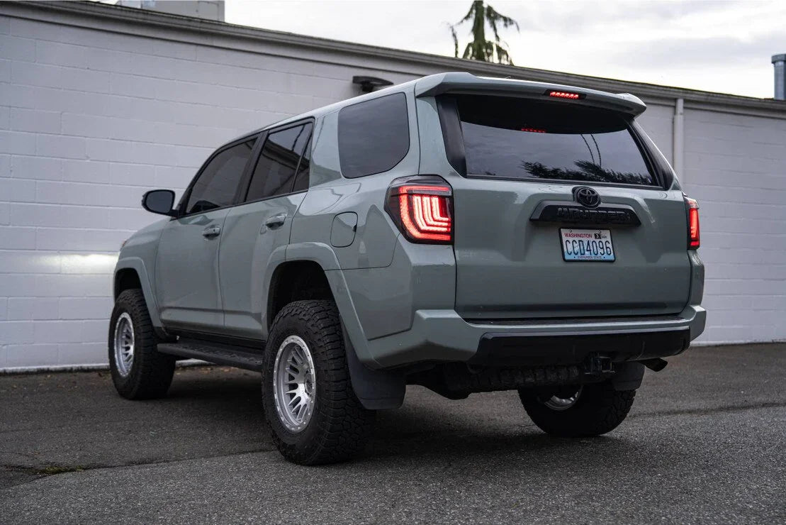 Toyota 4Runner SUV with aftermarket wheels and off-road tires parked outdoors