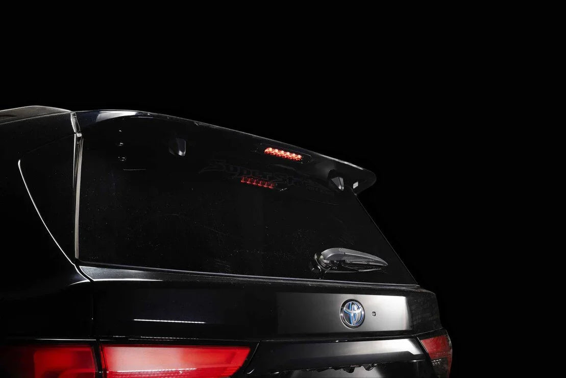 Toyota SUV rear with rear spoiler, LED brake light, and wiper, ideal for overlanding