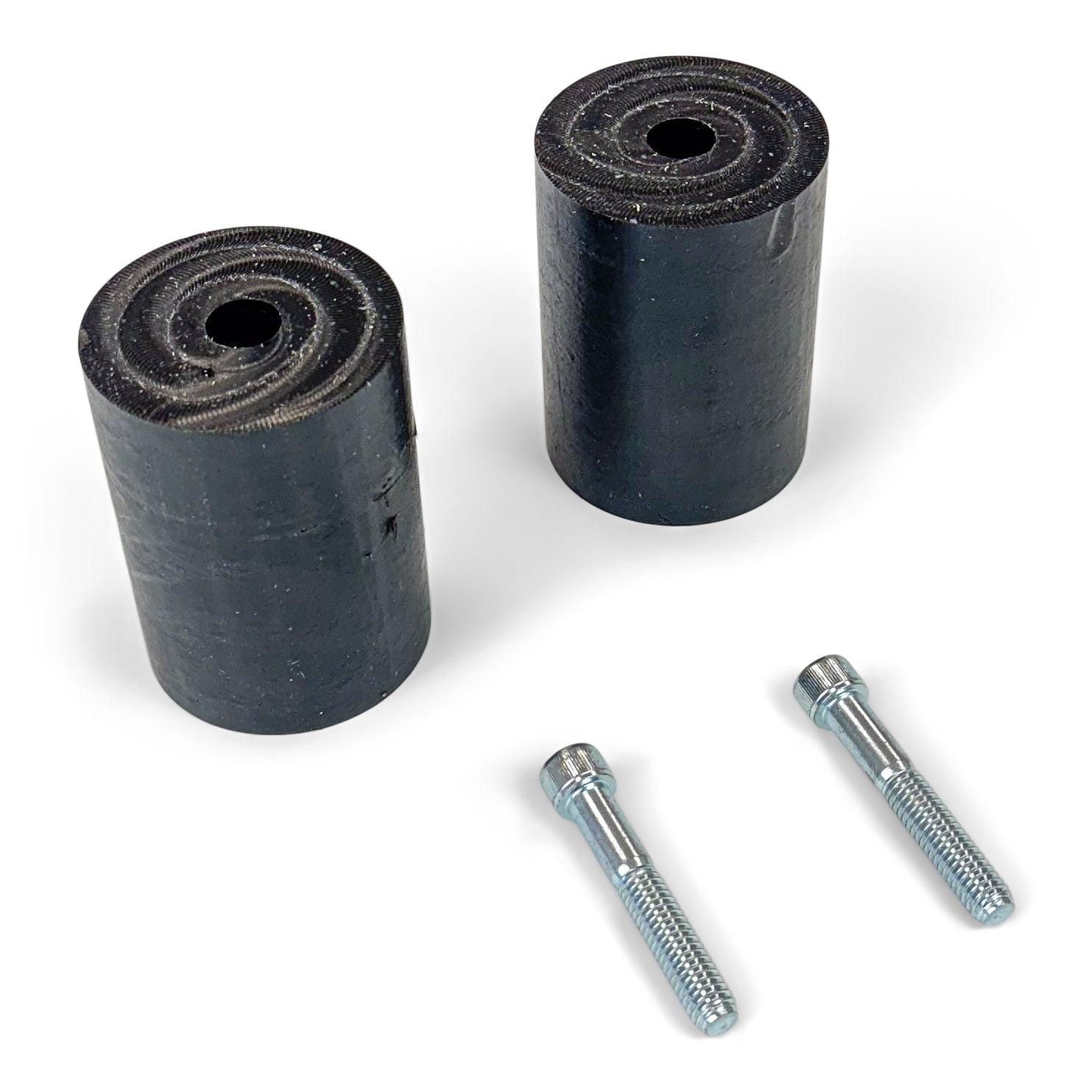 Black rubber bumper stops and two metal bolts for off-road vehicle accessories