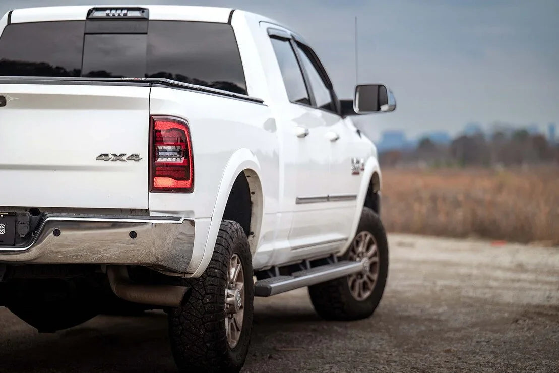 White Ram 1500 Classic 4x4 pickup truck with off-road tires parked outdoors