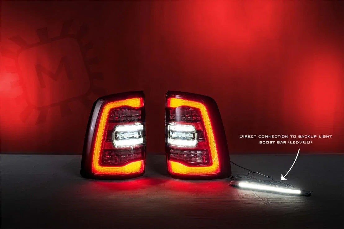 LED tail lights for Ram 1500 Classic with illuminated backup light boost bar on red background