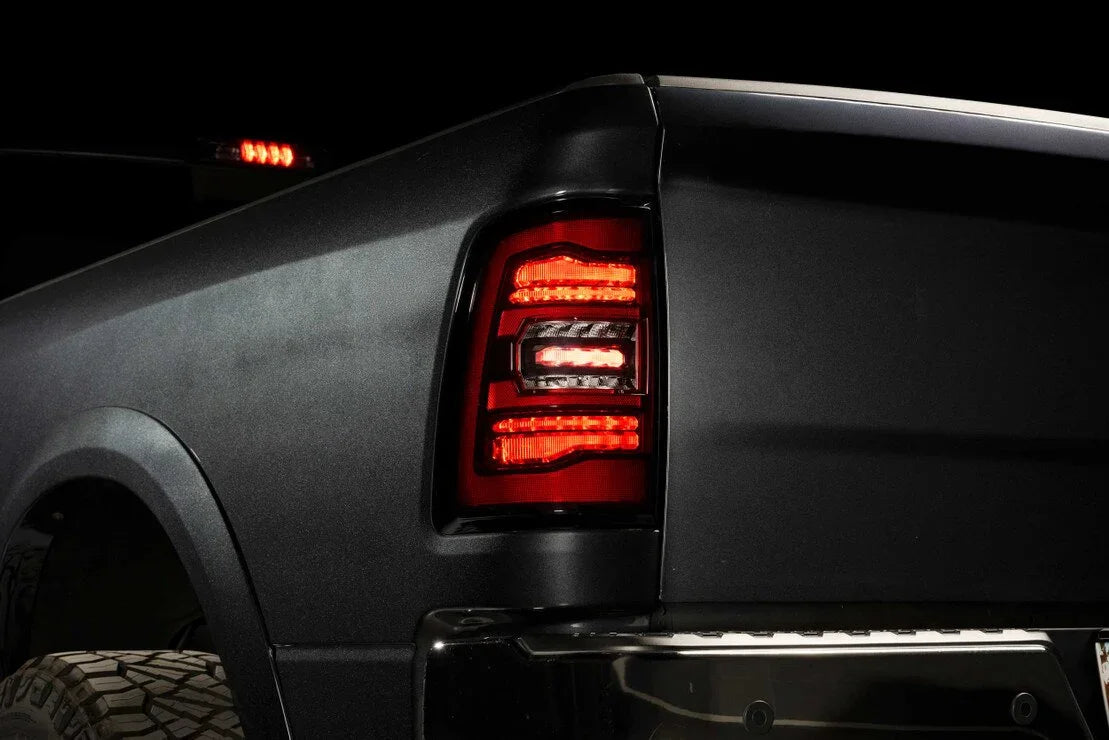 Close-up of LED tail light on a black Ram 1500 Classic truck at night