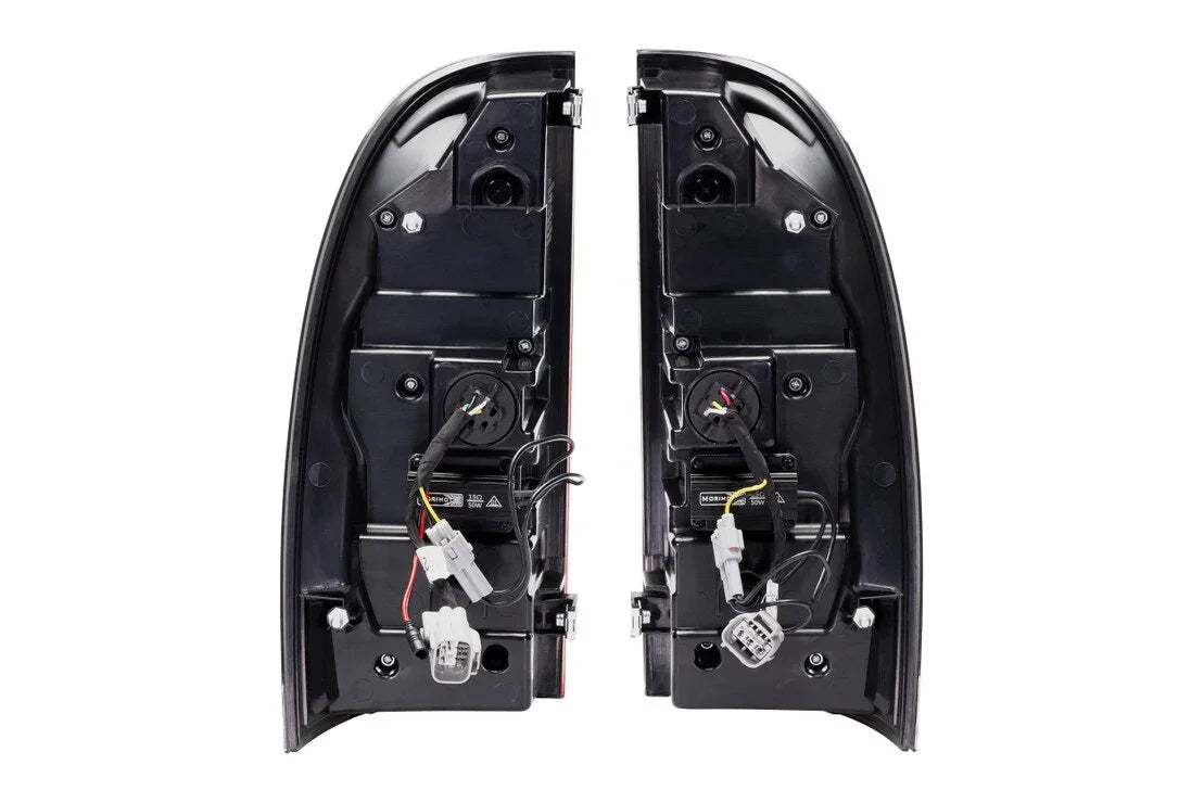 Pair of clear tail lights for Toyota Tacoma with wiring and connectors, rear view