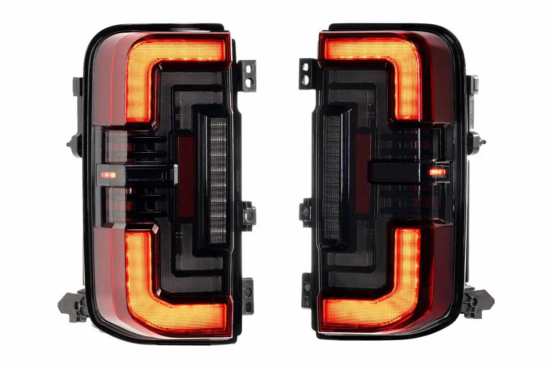 Red smoked LED tail lights for Ford Bronco 2021 and up, illuminated on white background