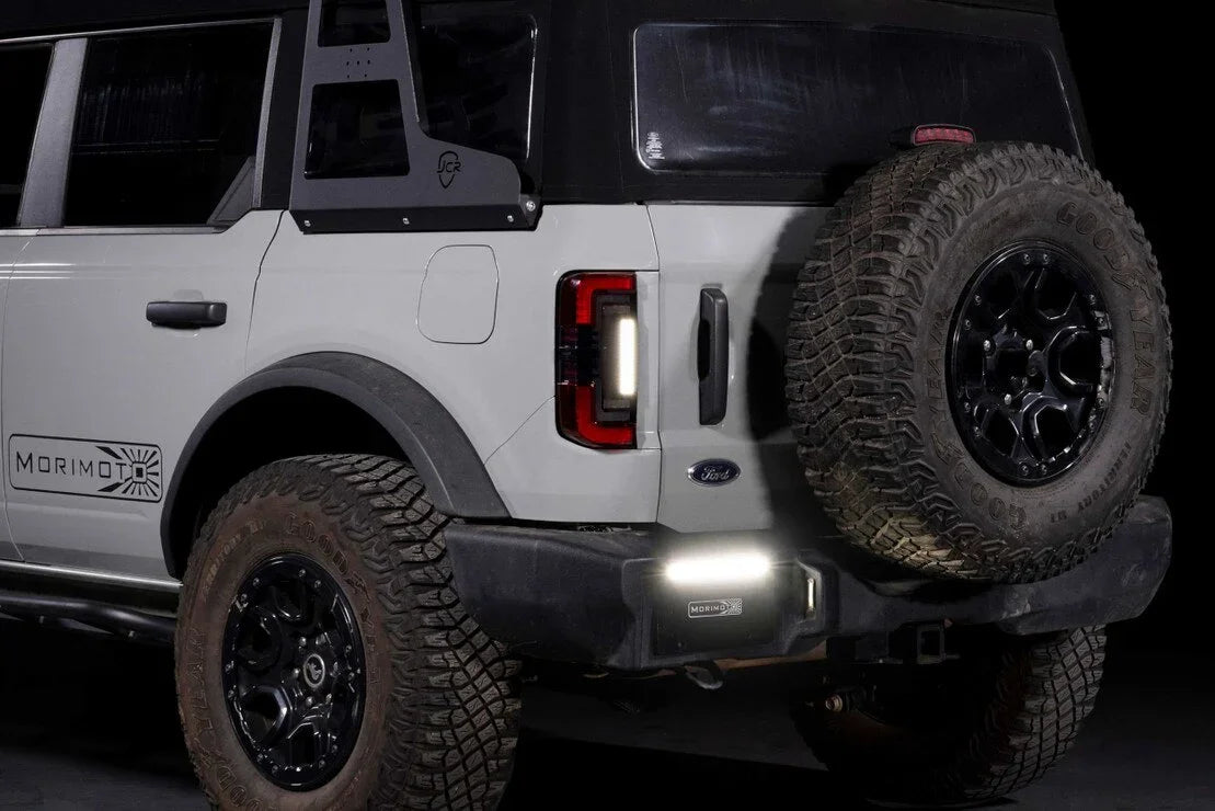 Ford Bronco rear with aftermarket red smoked tail lights and rugged off-road tires