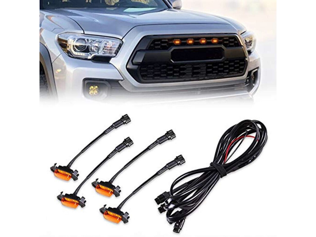 Toyota Tacoma grille amber LED marker lights kit with wiring, shown installed on truck