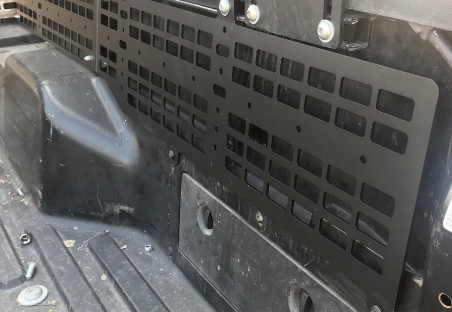 Toyota Tacoma bed MOLLE panel system installed for gear organization
