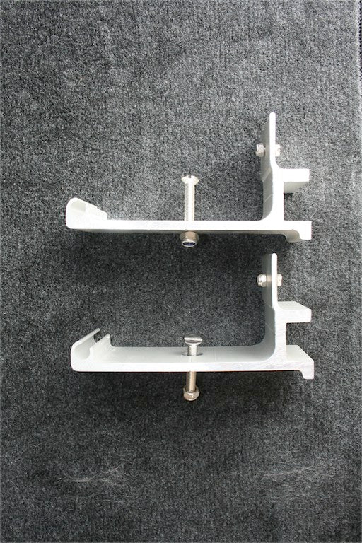 Pair of silver metal mounting brackets with bolts for overlanding vehicle accessories