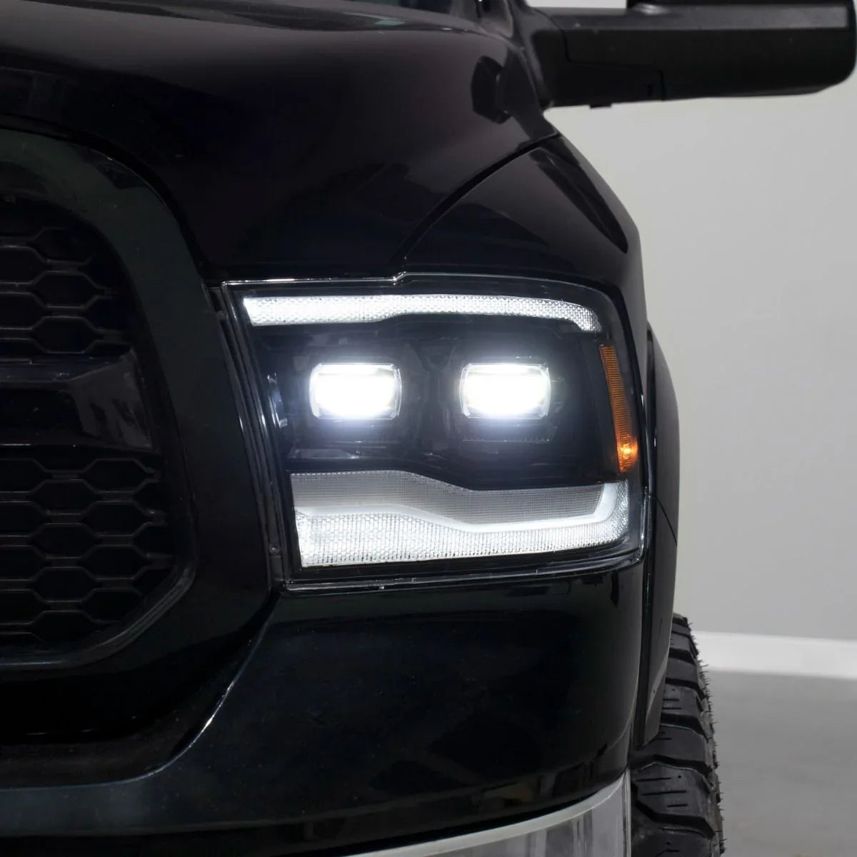 Close-up of 2014 Ram 1500 truck LED high beam headlight with bright illumination
