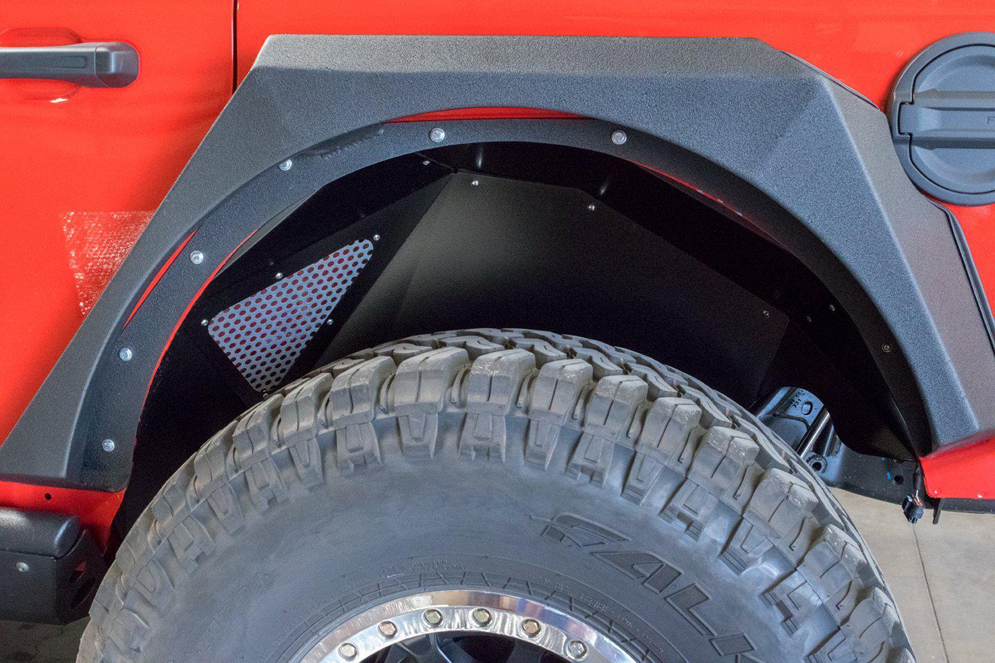 Black rear inner fender installed on Jeep Wrangler JL with off-road tire