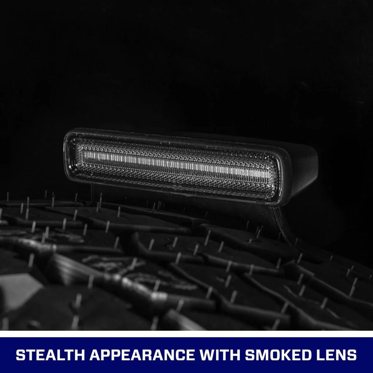 Jeep Wrangler JL third brake light with smoked lens, mounted on spare tire, black background