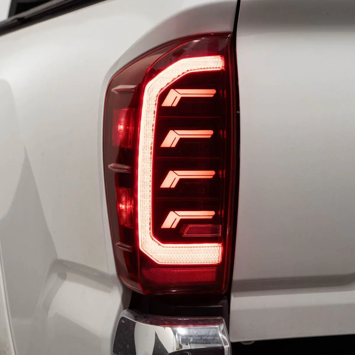 2018 Toyota Tacoma LED tail light close-up with modern red brake light design