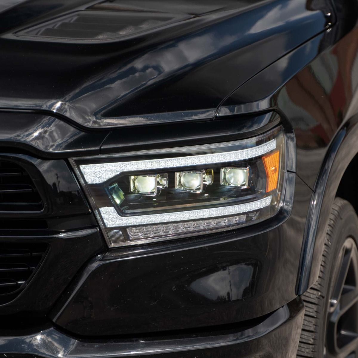 Form Lighting Sequential LED Projector Headlights for Ram 1500 2019–2024, close-up with low beam on