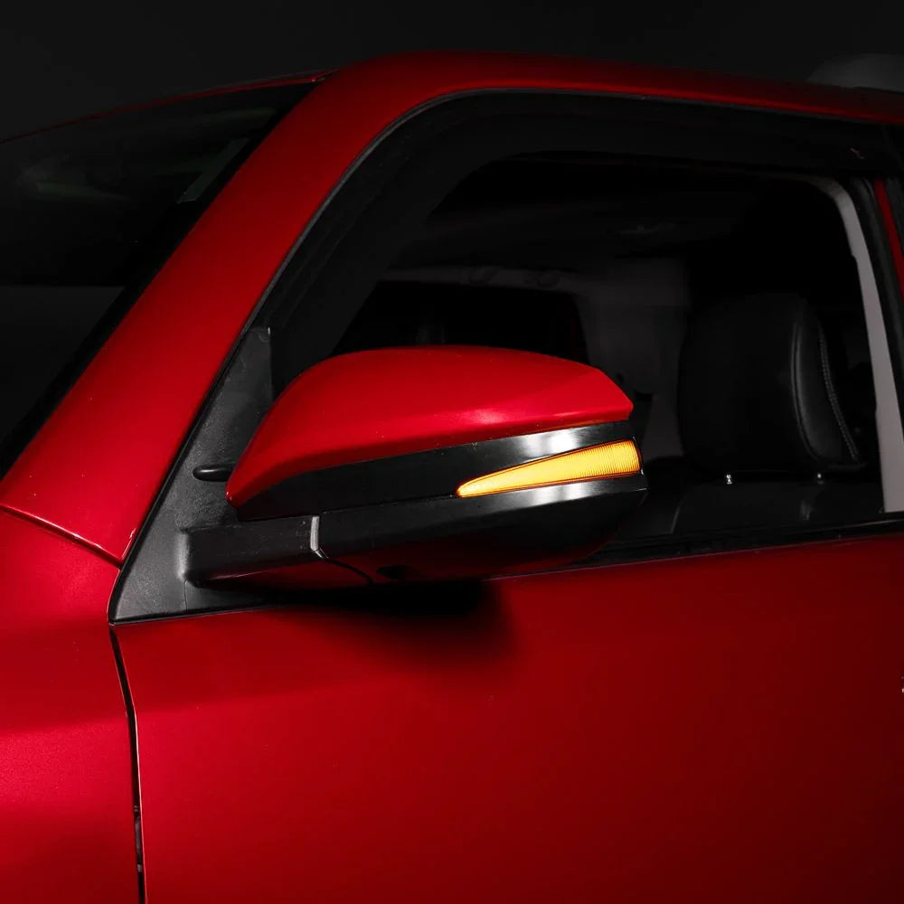 2020 Toyota 4Runner red side mirror with amber turn signal light illuminated