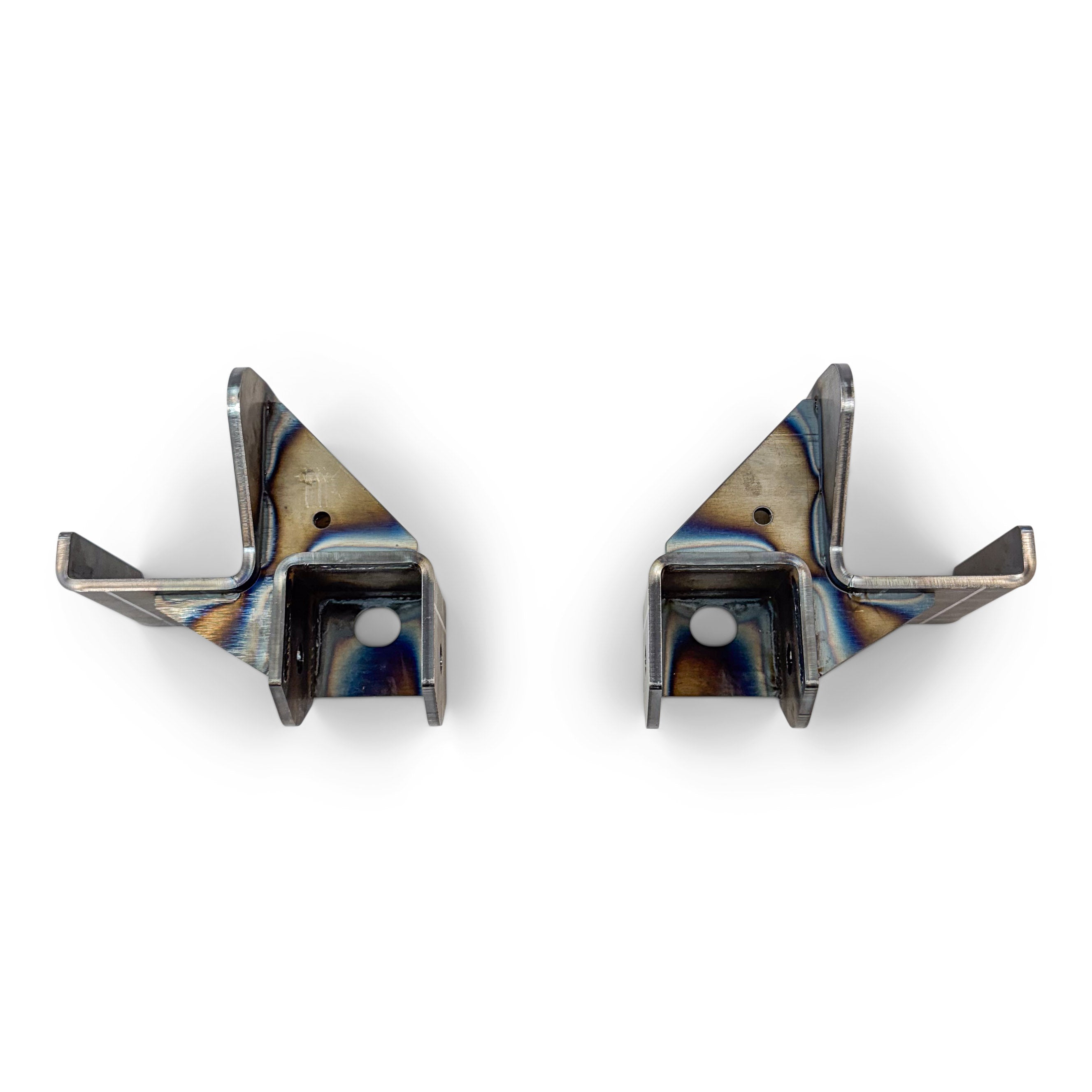 Pair of metal overland vehicle mounting brackets with weld marks on white background