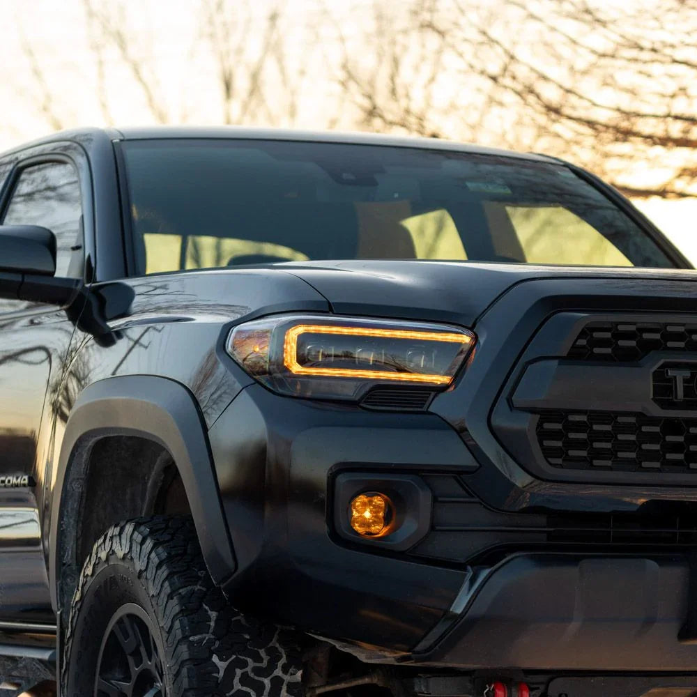 2022 Toyota Tacoma front view with aftermarket dual color DRL headlights and amber fog lights