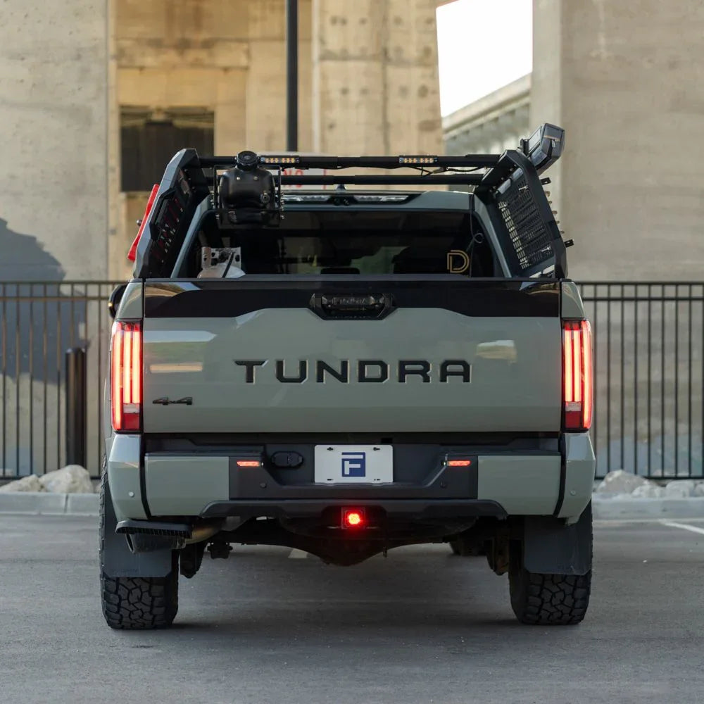 2024 Toyota Tundra rear view with aftermarket taillights and overlanding gear