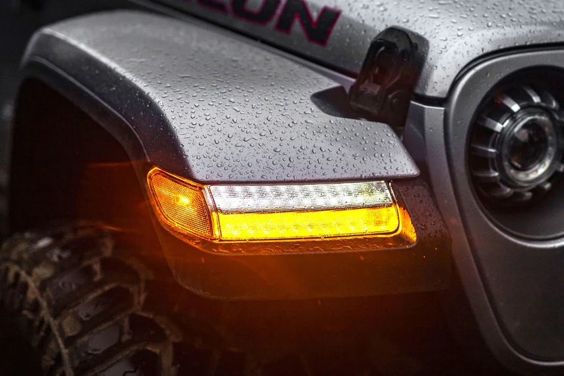 Jeep Wrangler JL with illuminated Morimoto XB LED side marker on wet fender close-up