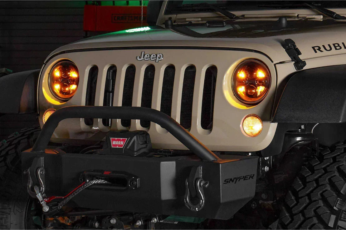 Front view of Jeep Wrangler Rubicon with aftermarket bumper, winch, and off-road lights