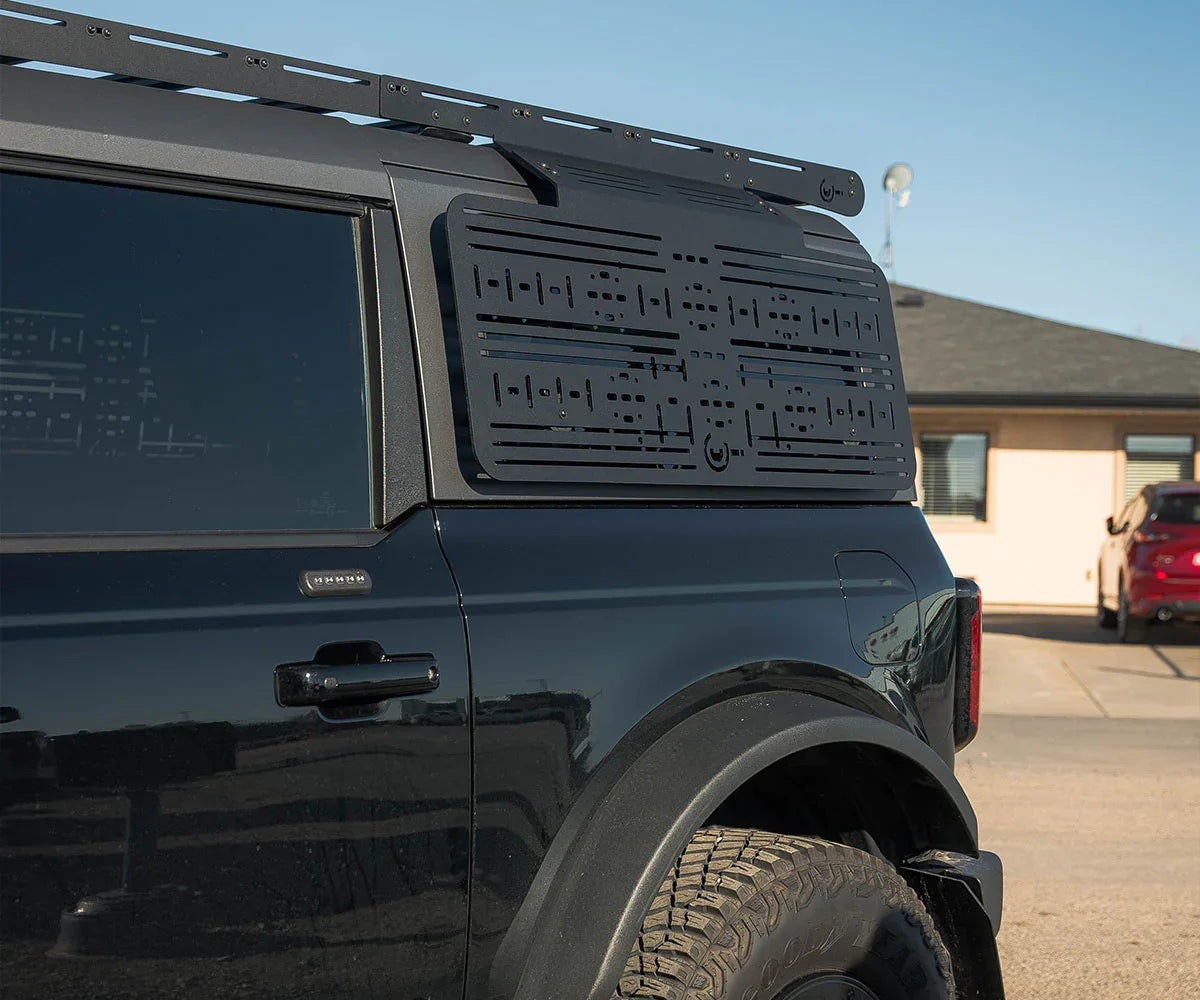 Ford Bronco with modular roof rack and side molle panel accessory for overlanding
