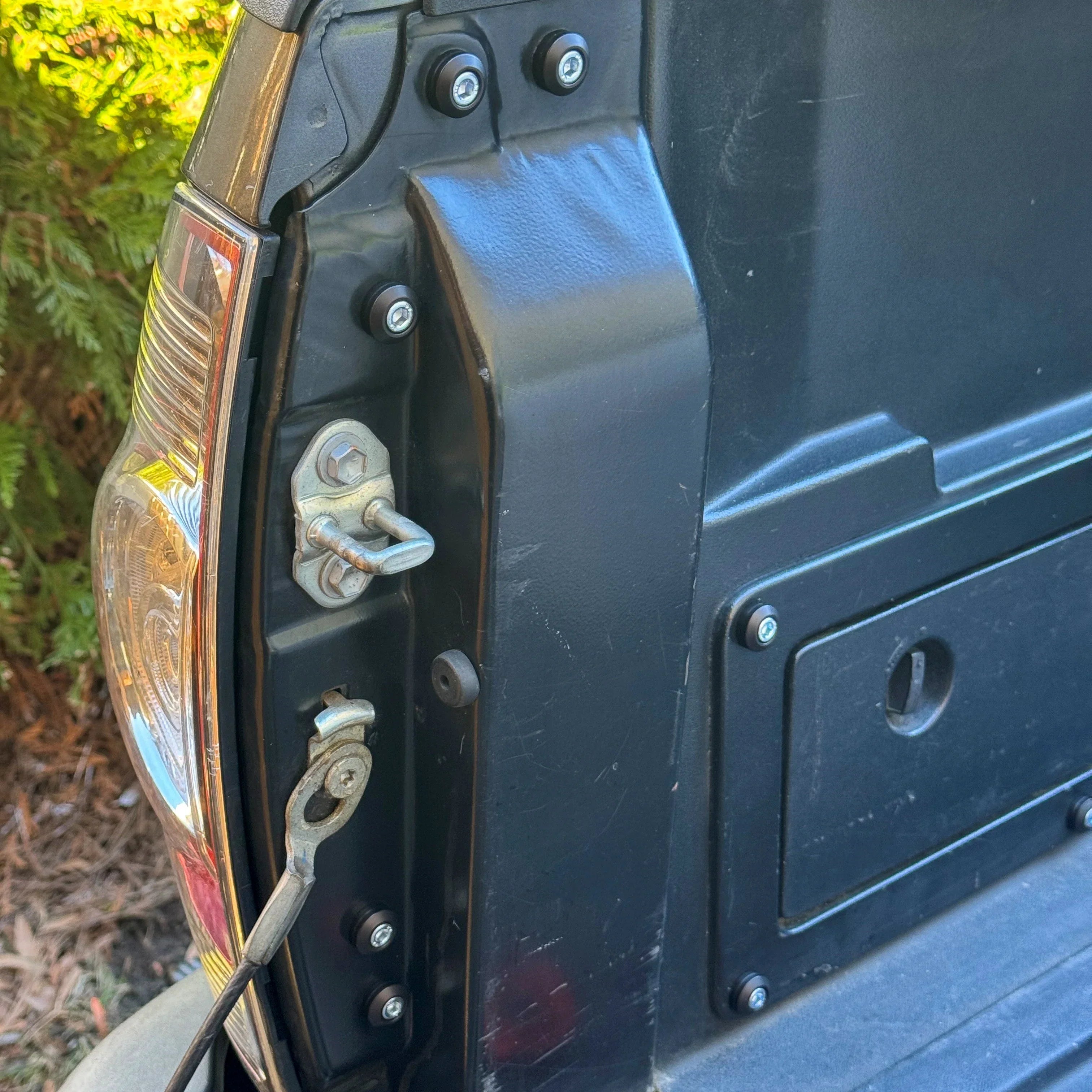 Close-up of 2nd gen Toyota Tacoma tailgate with dress up hardware kit installed