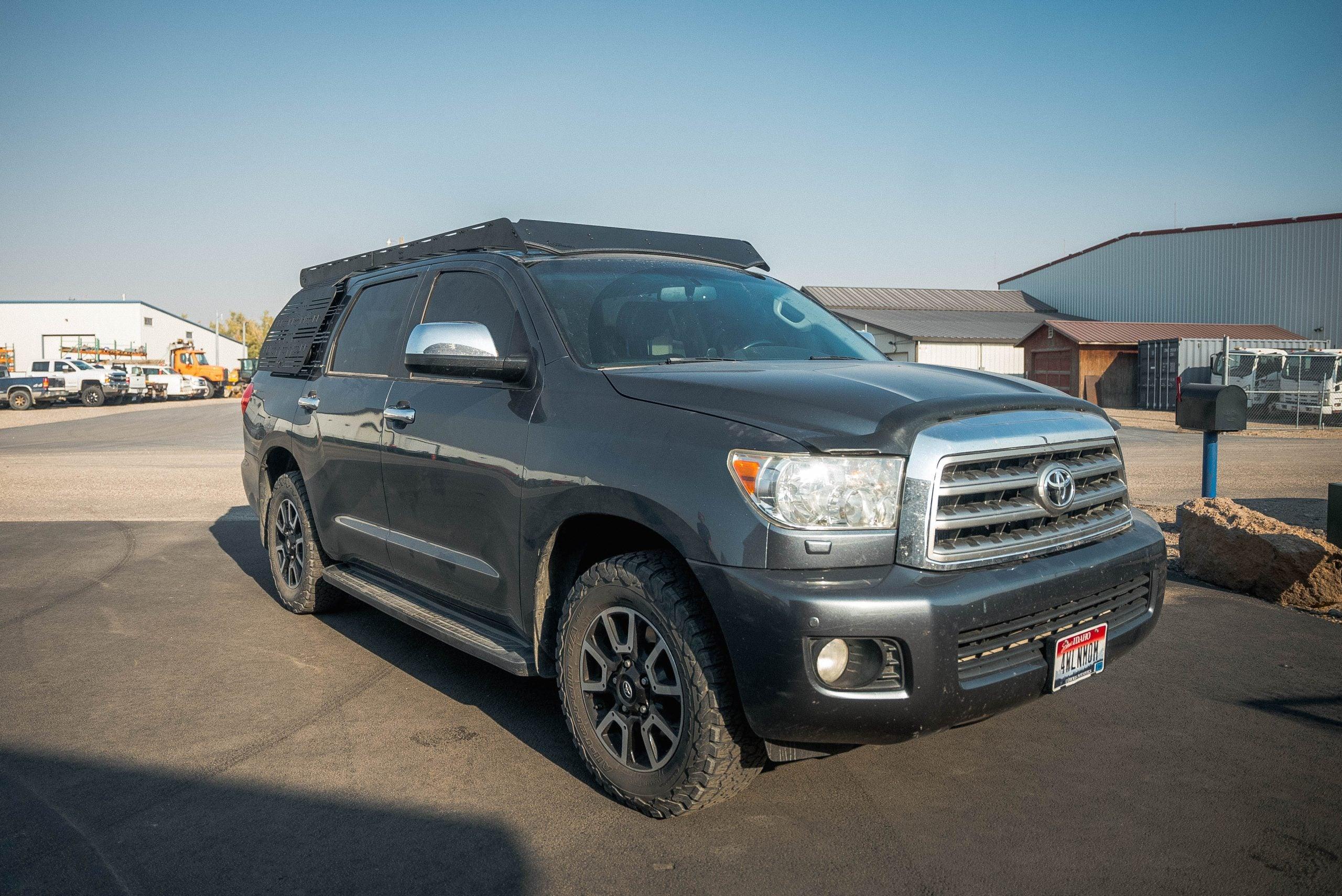 Toyota Sequoia SUV with roof rack and side panel gear mount for overlanding
