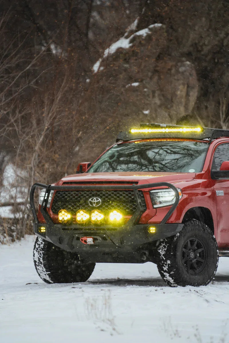 Toyota Tundra off-road truck with LED lights on snowy adventure trail
